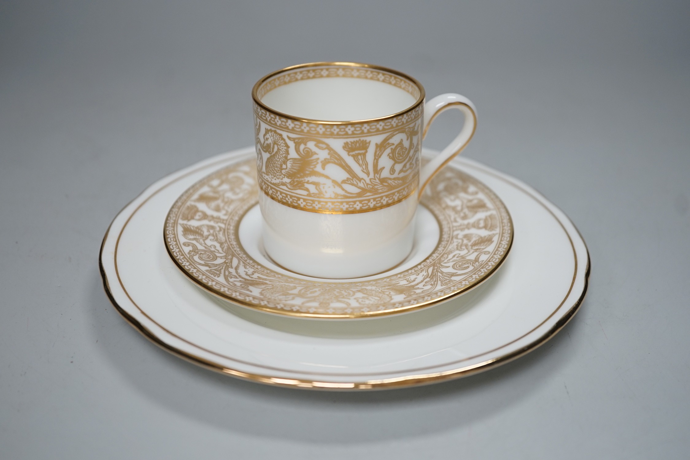 A Victorian Wedgwood part dinner service, with black printed classical borders, together with two Minton meat dishes and a Wedgwood gilt bordered coffee service.